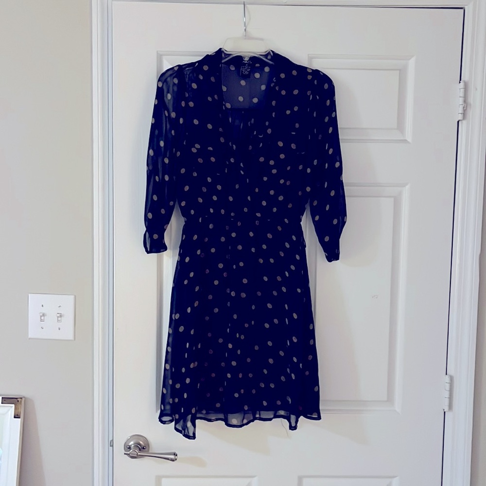 Navy dress with tan polka dot design.